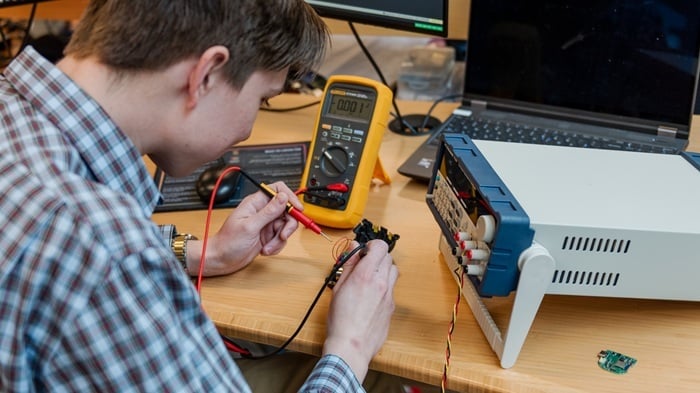 Electrical engineer testing prototype-700x