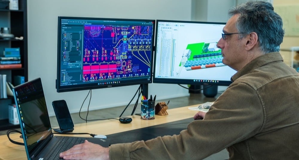 Electrical Engineer designs circuite board 2-1-1-1 Electrical Engineer designs circuite board 2-1-1-1