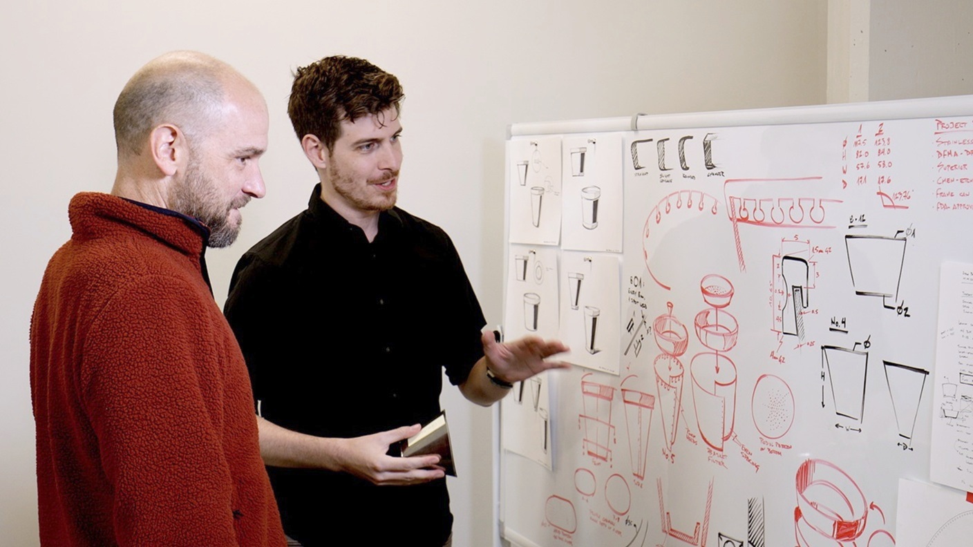 Industrial designer showing ideas to client
